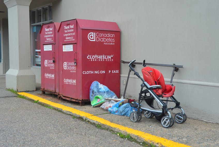 A couple of the Diabetes Canada donation bins in Kings County with an accumulation of garbage and discarded household items in July. Diabetes Canada advises against dumping at its donation bins, as the cleanup ties up resources that could be going to better purposes.