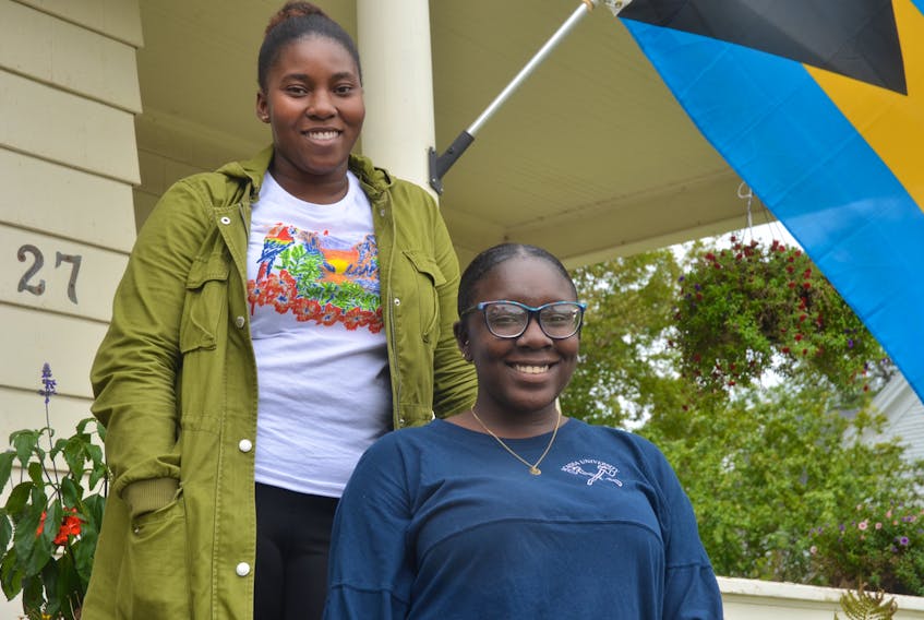 Ronniciea Saunders, front, and DeJan Brennen, two members of the Bahamian community at Acadia University, are proud of the work their alma mater is doing to help those affected by Hurricane Dorian in the Bahamas.