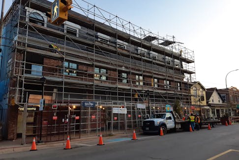 The scaffolding that once covered a property on Main Street in Wolfville is now down. The town will soon have a couple more high-end places for visitors to rent in the downtown core.
