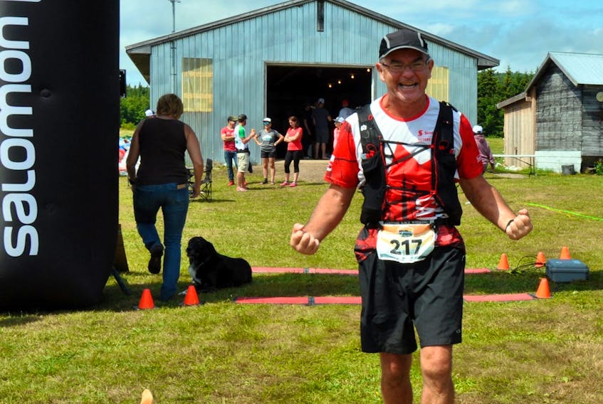 Roy Banks triumphantly crosses the finish line at the Capes 100, a grueling 100-mile trail run in Northern Nova Scotia.
CONTRIBUTED