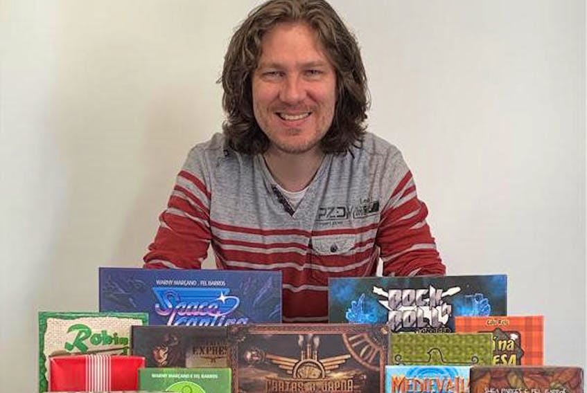 Ron Halliday, a native of North Alton, NS now living in Brazil, has published four board games, including one which is currently running as a Kickstarter to raise contributions for the production costs. Here, Halliday is featured with a series of board games from other designers.