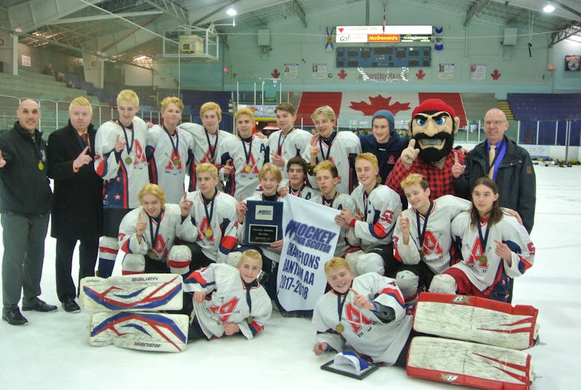 The Acadia Axemen defeated the Chebucto Atlantics 4-0 in Amherst on Sunday to win the Nova Scotia bantam AA championship. Members of the team, including the coaching staff, are shown with the championship plaque and trophy following the medal ceremony.