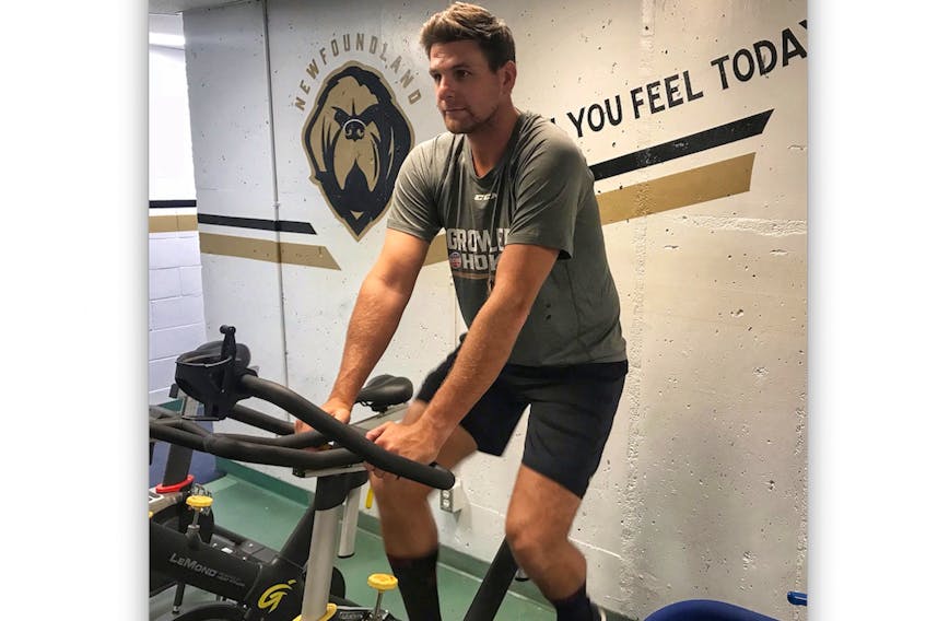 Defenceman Adam Pardy works out on the stationary bike on Sunday at Mile One Centre, where the Newfoundland Growlers conducted physicals for a number of their players. Pardy, the Bonavista native who many expect to be the Growlers’ inaugural captain, is one of 23 players on the ECHL expansion team’s training camp roster. On-ice sessions begin today at the Glacier in Mount Pearl. — Growlers photo/Ken O’Leary
