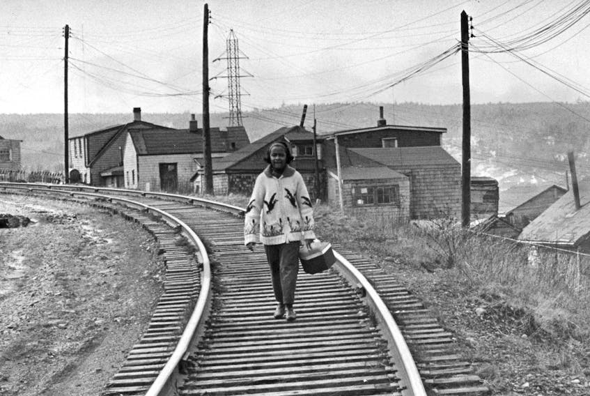 A girl is pictured walking along the train tracks in Africville in this file photo.