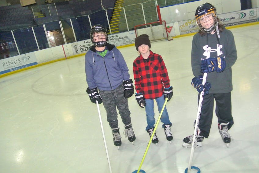 [From left] Kaylem Isadore, Austin Cormier and River Sears-Tower are some of the youth enjoying a game of ringette courtesy of the Town of Amherst’s free After The Bell Skating program