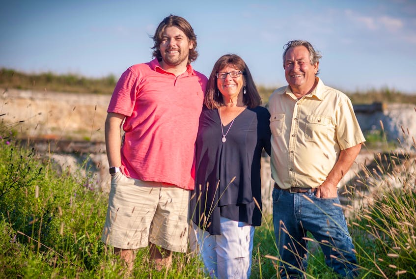 Agnes Rendell, pictured with her son, Jesse (left), and husband, Keith (right), credits Atlantic Canada’s first surgical robotics technology — and the donors behind it — for saving her life. - Photo Contributed.