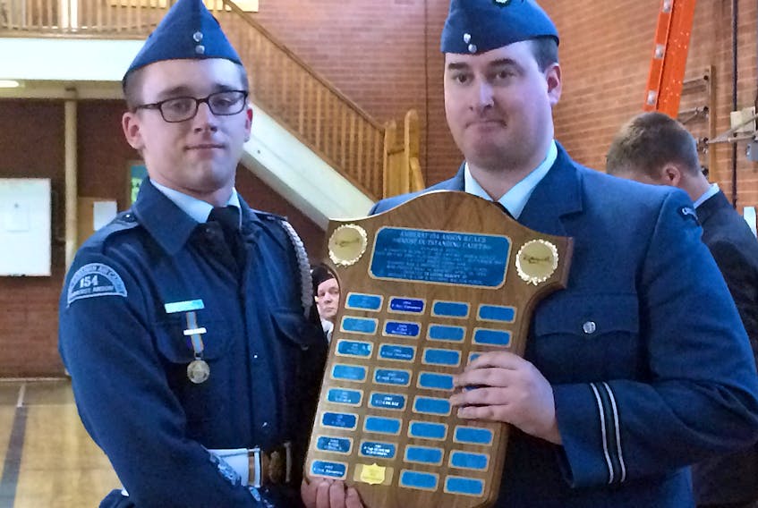 WO1 Brennan Brown (left) accepts the 154 Amherst Anson Royal Canadian Air Cadets Commander’s Award as Most Outstanding Cadet from deputy command Capt. Tyler Cooke during the organization’s 76th ceremonial review.