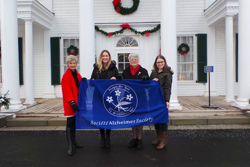 Lieutenant governor Antoinette Perry joins, from left, Corrine Hendricken-Eldershaw, CEO, Kate Shreenan, administrative and events coordinator, and Sara MacLean, education coordinator, in raising the Alzheimer Society flag at Fanningbank recently to launch Alzheimer Awareness month. During this month, the Alzheimer Society of P.E.I. will launch a social awareness campaign #ILiveWithDementia - Let me help you understand, to fight the stigma.