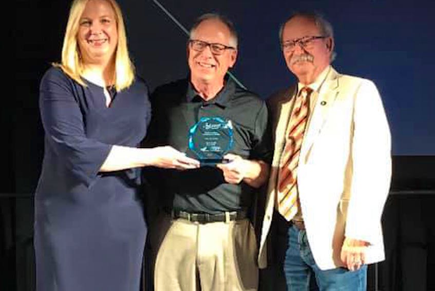 Cindy Mills, vice-president finance and strategy with the Nova Scotia Gaming Commission presents the Sport Nova Scotia Support4Sport Makes A Difference Award to Amherst recreation director Bill Schurman and Mayor David Kogon during the organization’s awards ceremony in Halifax on June 1.