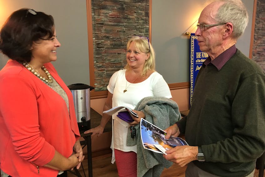 Amherst’s business development officer Rebecca Taylor (left) talks to Amherst businessperson Stephanie Allen and former town councilor about the town’s recently completed 2019 Community Economic Analysis that shows bringing new people to Amherst is more important presently than bringing new jobs because there are not enough people to fill the jobs already available.