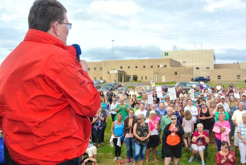 Dr. Brian Ferguson addresses a large crowd at a health care rally in front of the Cumberland Regional Health Care Centre on Wednesday evening. A crowed, estimated at more than 500, listened to doctors talk about the need for more support for the county’s lone regional hospital that is struggling with a shortage of physicians and declining programs and services.