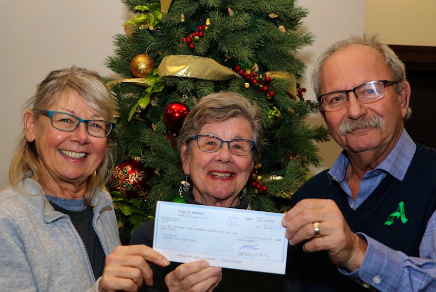 Amherst Area Heritage Trust vice-chair Denise Allan and chair Leslie Childs accept a $1,485 community support grant from Amherst Mayor David Kogon. The grant will be used to help host an event that will help preserve, promote and protect Amherst’s historic built heritage. Tom McCoag/Town of Amherst