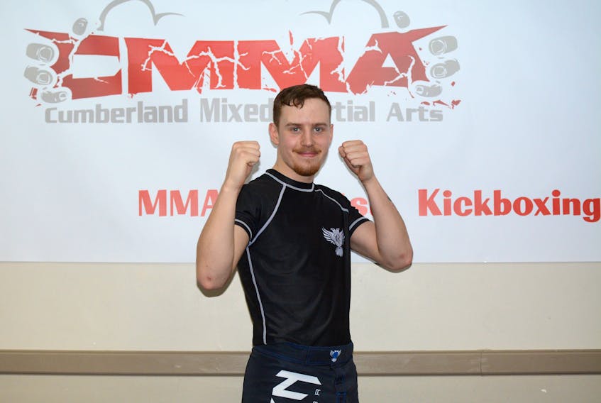 Dave Chapman strikes a pose at Cumberland Mixed Martial Arts in Amherst. Chapman recently fought on his first kickboxing match.