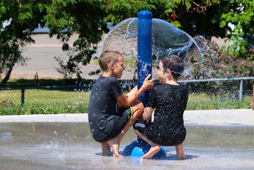 Children play at the Amherst Lions Splashpad located in the Amherst Lions Park on Hickman Street. The splashpad is the latest addition to the $500,000-plus park project. Tom McCoag/Town of Amherst photo