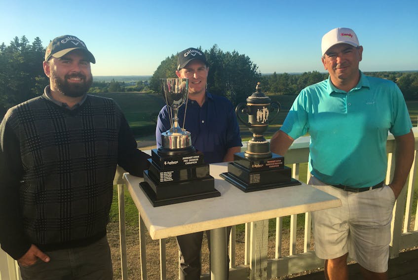 Amherst Golf Club pro Mike Archibald (centre) presents the Amherst Open pro championship to Thomas Keddy (left) of Maplewood Golf Club in Moncton and the amateur trophy to Craig Hollett of Grandview.