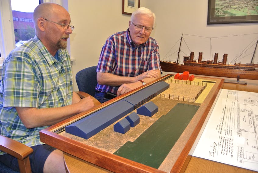 Matthew Casey (left) and his uncle, Cumberland-Colchester MP Bill Casey, look over a diorama of the First World War internment camp in Amherst that he made for a ceremony at the Col. James Layton Ralston Armoury in Amherst on July 2.