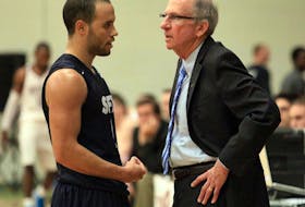 Former St. Francis Xavier basketball player Tyrell Vernon, left, will work with the university’s men’s and women’s team as an associate coach, with the plan to succeed X-Men head coach Steve Konchalski, right, following the 2020-21 AUS season. Konchalski talks to Vernon during a game against Saint Mary's in 2011.