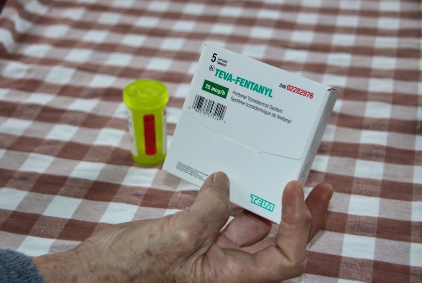 Carma holds an empty Fentanyl package.