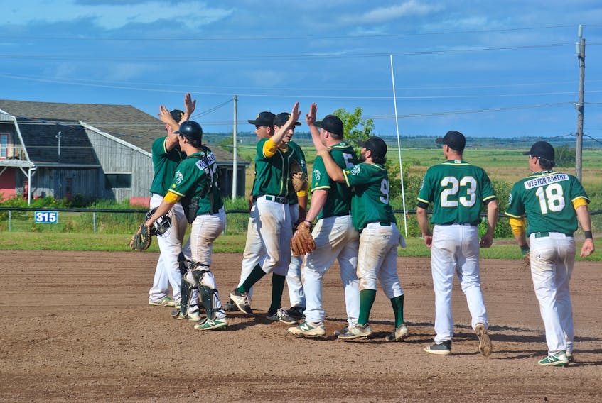 Members of the Amherst Athletics celebrate after a 6-3 win over the Cape Breton Marlins in semifinal action at the Nova Scotia Intermediate AA Baseball Championship tournament on Sunday.
