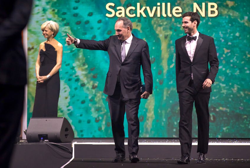 Atlantic Industries Limited president Mike Wilson, left, and his son Riley, vice-president of operations for Eastern Canada, walk on stage to accept the award for one of Canada’s Best Managed Companies.