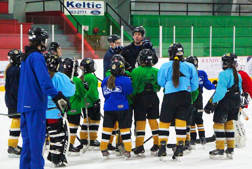 Coach Greg Morrow addressing the Antigonish Atom ‘A’ female Bulldogs players during a recent practice as the team prepared for the playoff tournament they're hosting this weekend at the Antigonish Arena, with one game (a semi-final) at the Keating Centre.