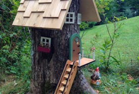 When one of the MacPhee's big trees had to come down, they decided to have some fun with it. Wendy's husband cut the door and windows and Wendy painted them. They didn't miss a thing – from the lovely shingled roof to the welcoming flowers on the front door! Now the gnomes in Debert, N.S. have a lovely new home.