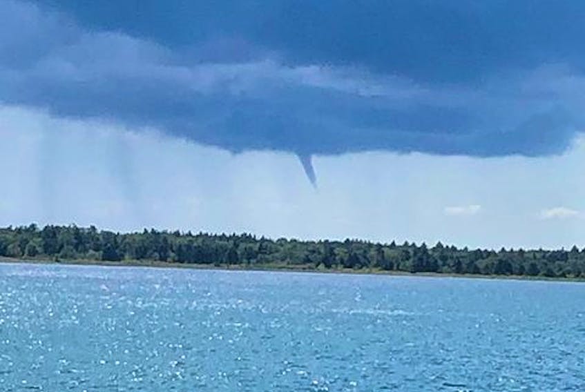 These are two great photos of the now-famous Stephenville waterspout, taken by Steve Angel last Monday afternoon. They show the developing stages of the spout as it reached down towards the water.