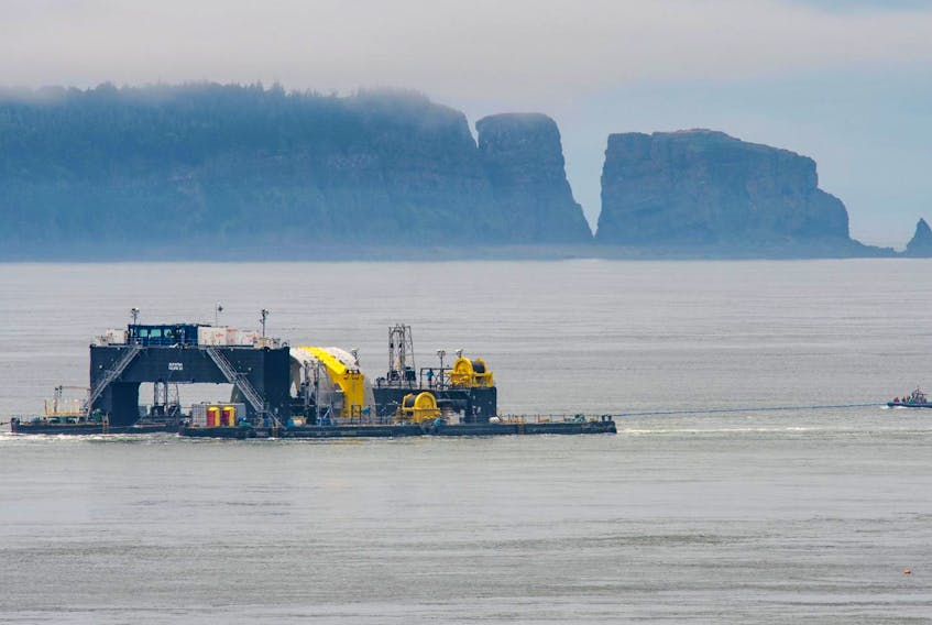 
The purpose-built barge Scotia Tide transports a tidal turbine near Parrsboro in July 2018 prior to its deployment in the Minas Channel. The barge is needed to remove a turbine from the sea floor but the creditors circling the now-defunct company behind the project want it sold. - Richard Stern
