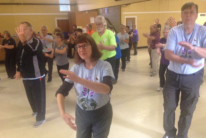 
Bonnie Bobryk, president of the Halifax branch of Fung Loy Kok Taoist Tai Chi, leads an open house teaching tai chi movements to participants. Fung Loy Kok Taoist Tai Chi was celebrating International Seniors Day with the event at Woodlawn United Church in Dartmouth. - Suzanne Rent
