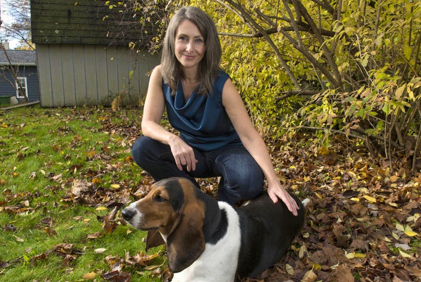 
Author Nicola Davison poses for a photo with her basset hound in the backyard of her Dartmouth home in early November. Davison’s debut novel, In The Wake, was released earlier this year. (RYAN TAPLIN/ THE CHRONICLE HERALD)

