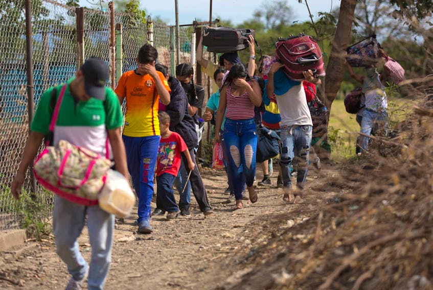 Venezuelans illegally cross into Colombia, to Villa del Rosario, along a path known as a trocha. The UN refugee agency and the UN migration agency say that 2.4 million Venezuelan refugees and migrants are in Latin America and the Caribbean.