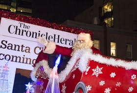 
Santa Claus waves to the crowd on Barrington St. on Saturday night. Thousands of people lined the streets of downtown Halifax tor the annual Chronicle Herald Holiday Parade of Lights. - Ryan Taplin
