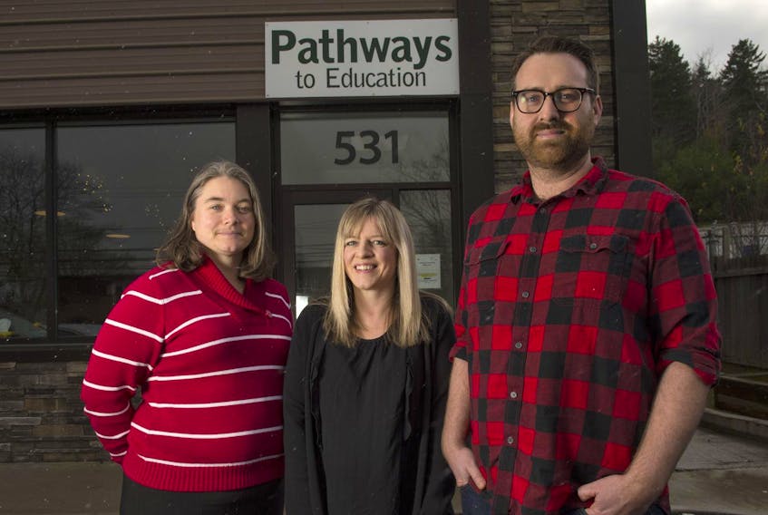 Adrianna MacKenzie, executive director of Chebucto Connections with Pathways to Education program manager Katie Phillips and program director Connor MacEachern on Wednesday afternoon outside the community group’s office on Herring Cove Rd.