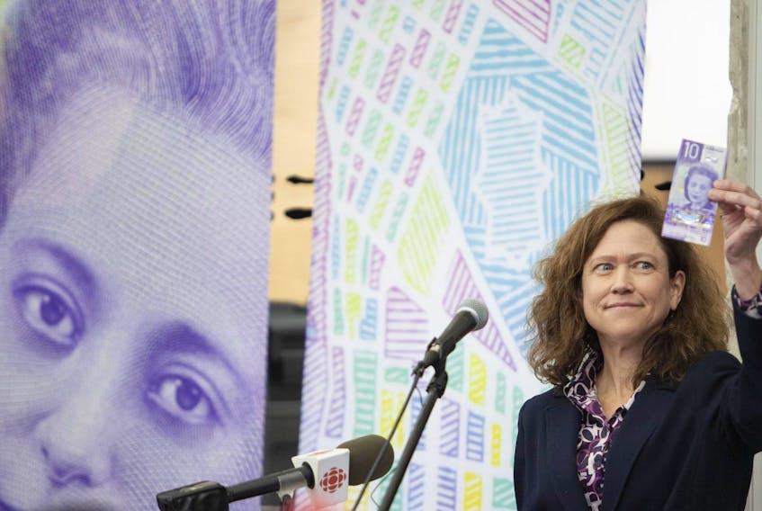 
Monique LeBlanc, Atlantic Regional Director for the Bank of Canada, holds up a Viola bank note at an unveiling event at the Delmore Buddy Daye Learning Institute on Monday. The $10 bill features civil rights icon Viola Desmond. This bill also marks the first time a woman, except for Queen Elizabeth, appears on Canadian currency. - Eric Wynne
