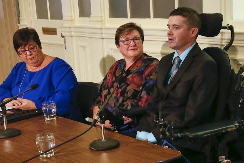 
Kimberly Carter and Deana Davis look on as Bill Duff, who lives with ALS, speaks during a news conference at Province House in Halifax on Wednesday. Carter is president and CEO of the ALS Society of New Brunswick and Nova Scotia and Davis lost her husband to ALS in 2015. - Tim Krochak
