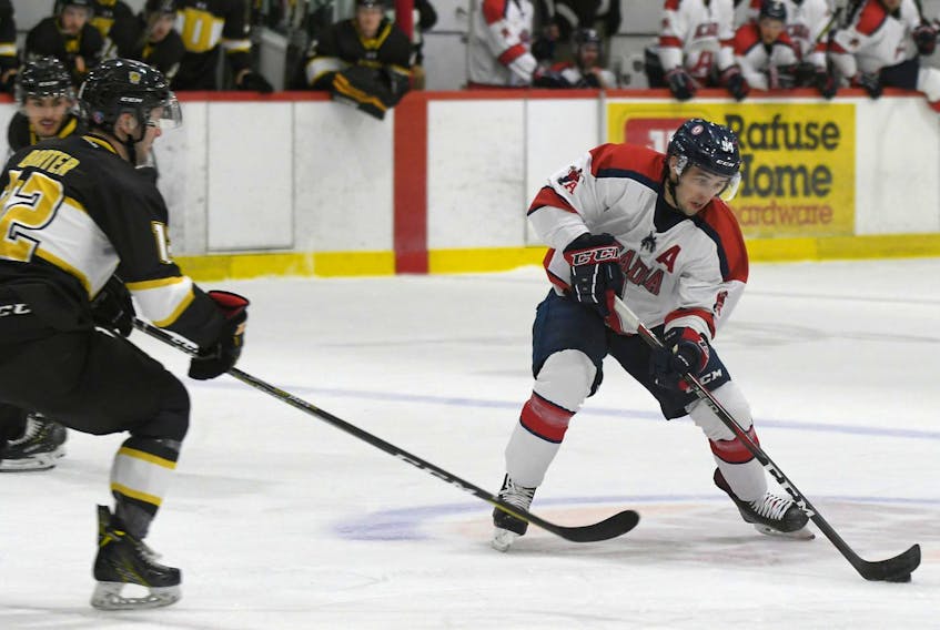 
Acadia Axemen forward Kyle Farrell skates into the Dalhousie zone as the Tigers’ Jake Barter defends during an Atlantic University Sport men’s hockey game on Oct. 12 in Wolfville. (PETER OLESKEVICH/ ACADIA ATHLETICS)
