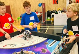 
From left: Thomas Duke, Alex Churchill and Aidan Langille from the 21st Century Space Guys test out their Lego robots before the final competition at the FIRST Lego League qualifier at NSCC Annapolis Valley Campus in Middleton on Saturday, Dec. 1. - Heather Desveaux
