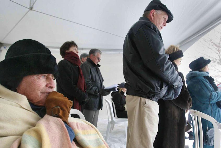 
Halifax Explosion survivor James Claes, left, bundles up to keep warm while listening to the memorial service at Fort Needham marking the 90th anniversary of the explosion in 2007. (FILE)
