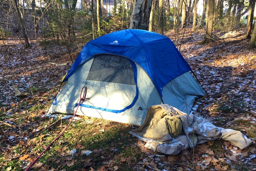 
A tent with a polite message asking people to stay out sits in Point Pleasant Park near the old stone house and the municipal parks building Wednesday. - Francis Campbell
