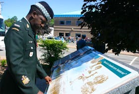 
Chief Warrant Officer Kevin Junor checks the monument on Pictou’s waterfront that is dedicated to the memory of the No. 2 Construction Battalion of the Canadian Expeditionary Force, in this 2008 photo. - Tom McCoag / File
