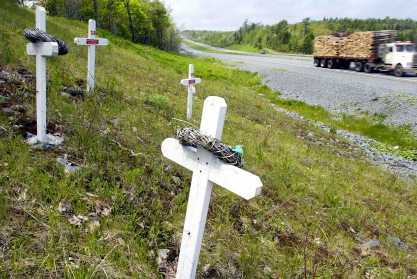 
The four MADD memorial crosses in the memory of, Katherine Willow Bradley, Dale Allen Heffler, Ernest Joseph Arseneau and Cheryl Anne Llewellyn killed by a drunk driver on June 25, 1988 stand overlooking the site of the accident Highway 101. (File)
