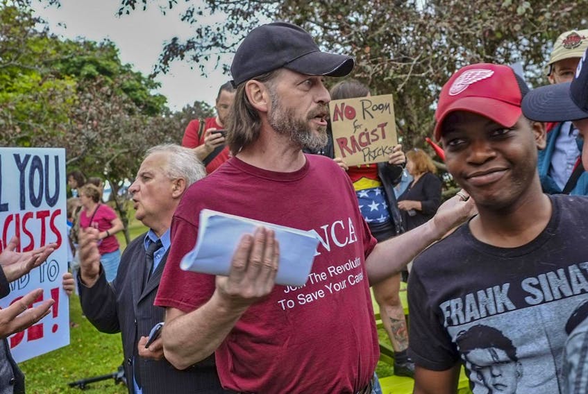 
Five supporters of the National Citizens Alliance (NCA) who attempted to hold a rally were stymied by several dozen pro-immigrant, anti-fascist demonstrators in the park behind the Alderney Library in Dartmouth on Aug. 19.
TIM KROCHAK 


