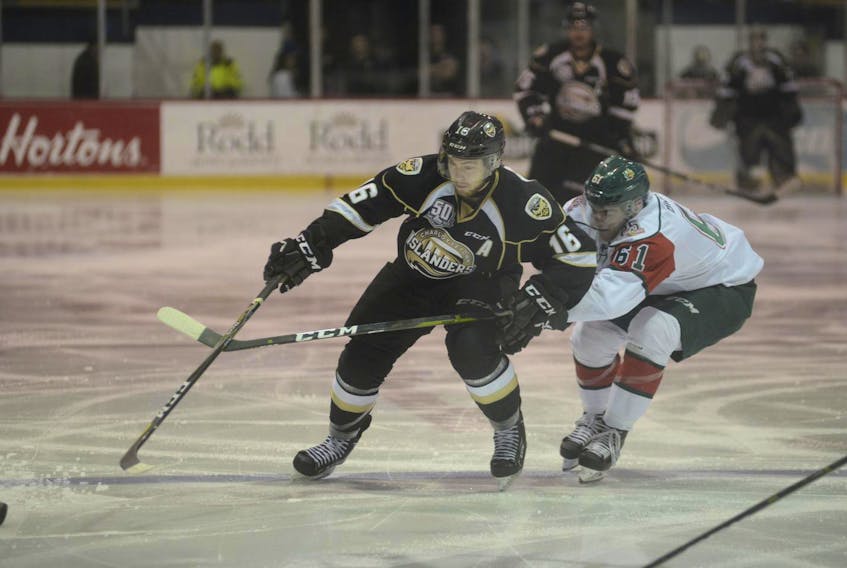 
Charlottetown Islanders assistant captain Keith Getson, a Bridgewater native, fights off Halifax Mooseheads forward Joel Bishop Sunday during Quebec Major Junior Hockey League action in Charlottetown. (JASON MALLOY/Charlottetown Guardian)
