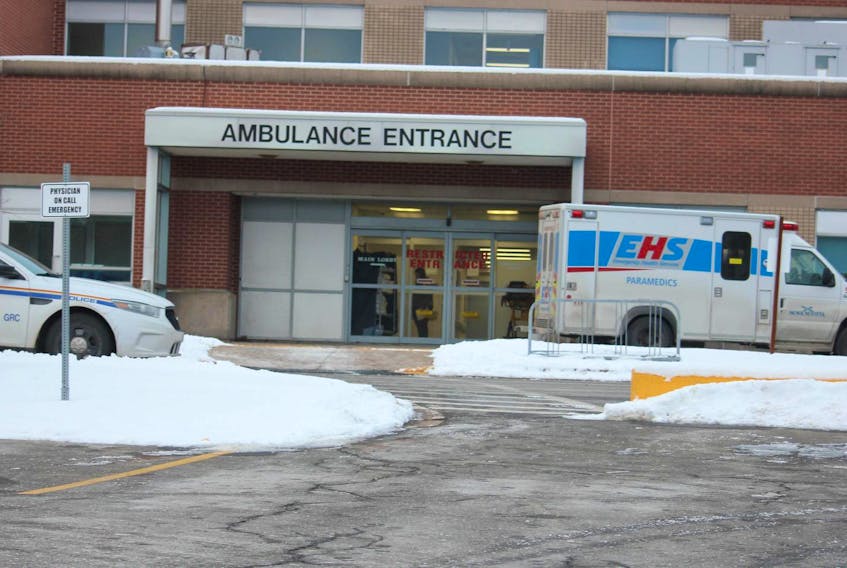 
An RCMP cruiser and EHS ambulance sit outside the emergency department at Valley Regional Hospital in Kentville on Tuesday morning. Police would not immediately confirm reports that a suspect was taken there for treatment after a standoff along Highway 101 at Berwick. - Ian Fairclough
