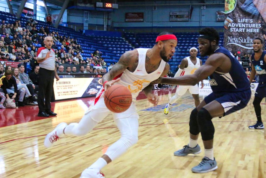 
Sudbury’s Braylon Rayson drives to the basket against the defence of Halifax’s Gabe Freeman and Cliff Clinkscales during an NBL Canada game Sunday afternoon in Sudbury, Ont. Rayson scored a game-high 34 points as the expansion Five defeated the Hurricanes 120-110. (John Sabourin)
