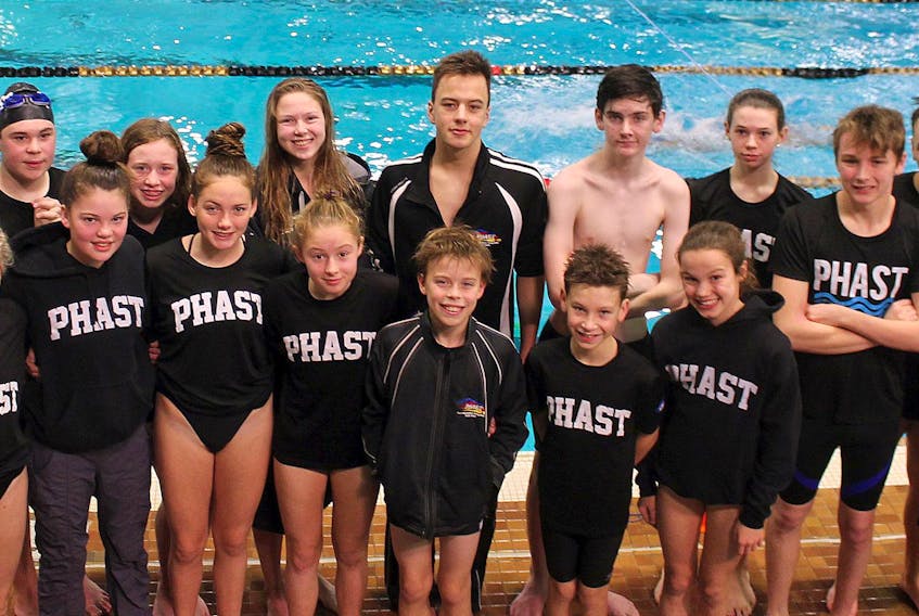 
PHAST athletes Mariah Austen (front, left), Baileigh Bekkers, Hannah Austen, Olivia Langley, Zack Elsworth, Riley Avery, Lily MacLean, Malcolm Cameron (back, left), Jacob Pinkohs, Emma Crispo, Colleen MacLeod, Matthew Penner, Kieran McInnis, Cora Kehoe, Cole Beaver, Aidan Doucet and Josh Elsworth swam earlier this month during a meet at Dalhousie University. - Contributed
