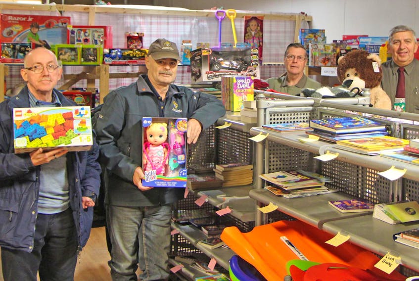 
The Monsignor Hugh MacPherson Council of the Knights of Columbus toy drive is in full swing in Antigonish. Volunteers, including Regis MacDonald (left), Leslie Chisholm, Hugh Richardson and Clarence Deyoung, are busy filling orders for families in Antigonish town and county. - Corey LeBlanc
