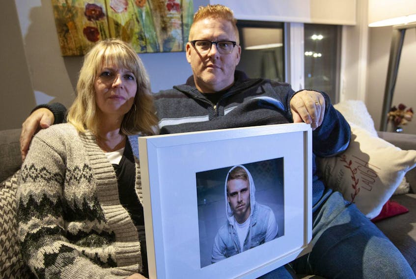 
Russ and Yanna Conway hold a photo of their son Garret. Garret took his life in March. Eric Wynne THE CHRONICLE HERALD
