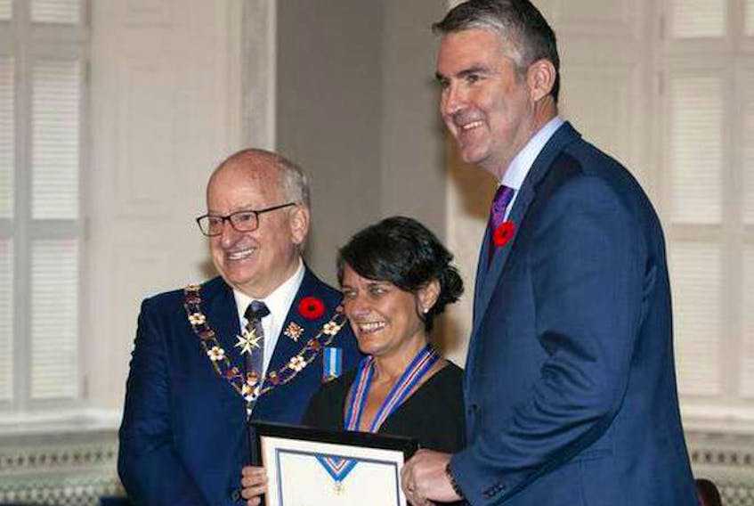 Patti Melanson, a nurse and homeless and vulnerable persons advocate, receives the Order of Nova Scotia during a ceremony at Province House last month. With her is Nova Scotia Lt.-Gov. Arthur J. LeBlanc, left, and Premier Stephen McNeil.