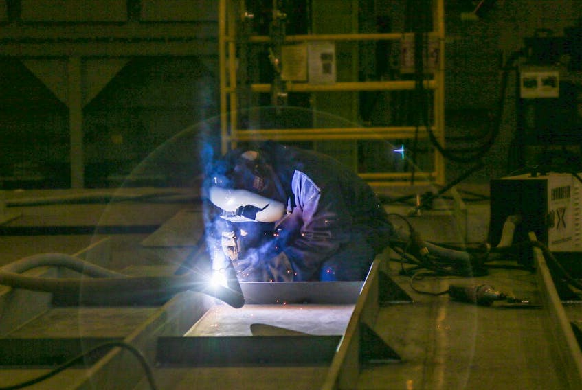 A worker welds steel into place while working on what will be the polar vessel Max Bernays, in the Assembly Hall at the Irving Shipyard in Halifax earlier this month.